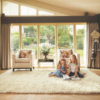 Two children sitting on a white rug in a living room with large windows.