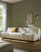 White sofa with a yellow pillow in a living room setting