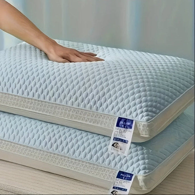 Two quilted mattress toppers stacked on a bed with a hand touching one of them, labeled '2PCS'.