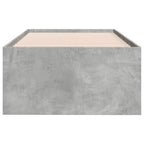 Concrete bed frame with wooden slats on a white background