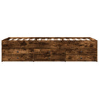 Wooden bed frame with drawers on a white background