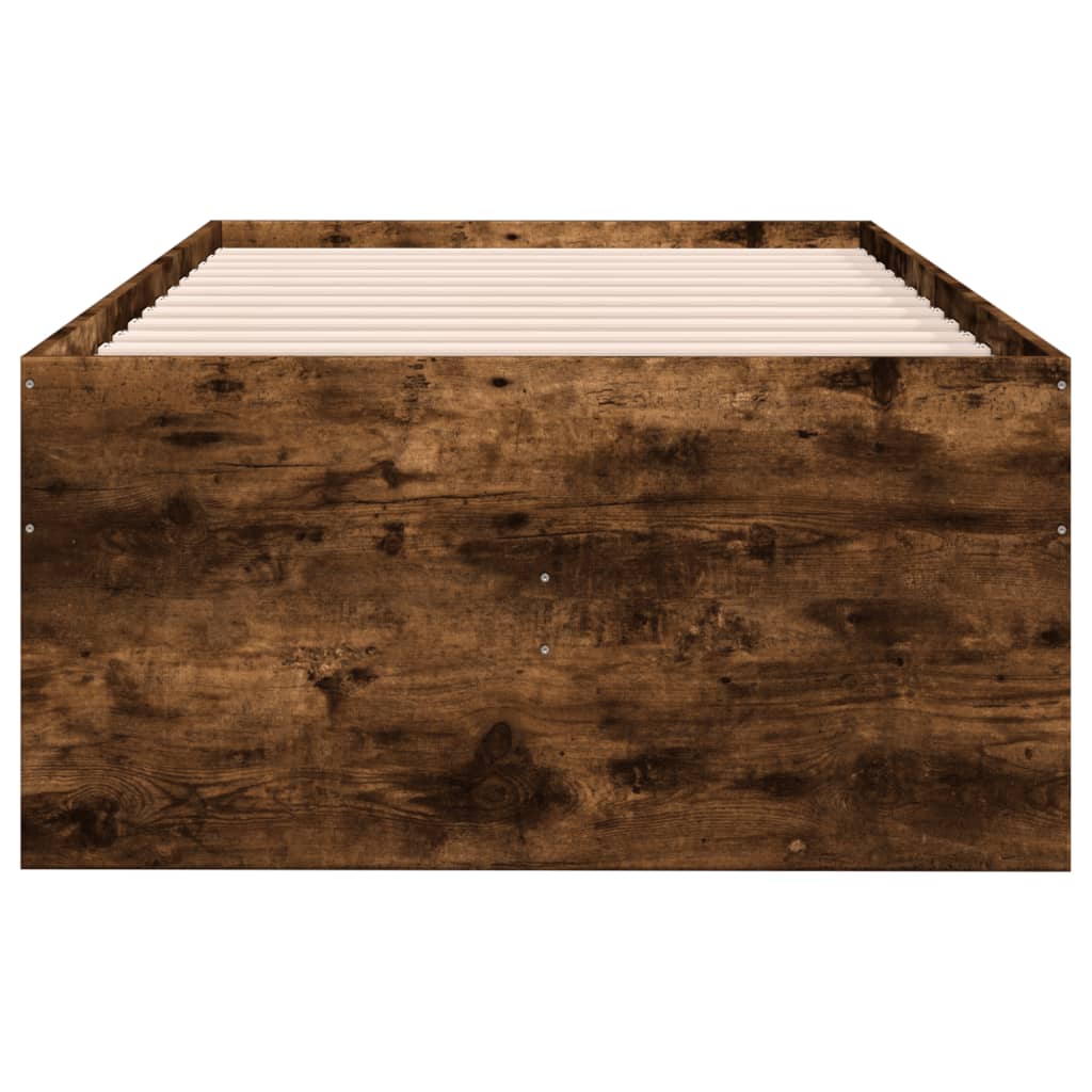 Wooden bed frame with slatted headboard on a white background