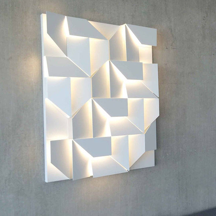 Geometric wall light fixture on a gray wall