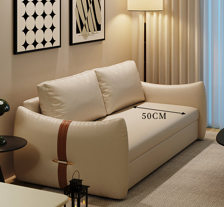 Beige sofa with a brown strap measurement label in a living room setting.
