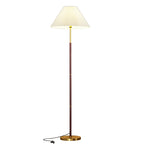 Floor lamp with pleated shade on a white background