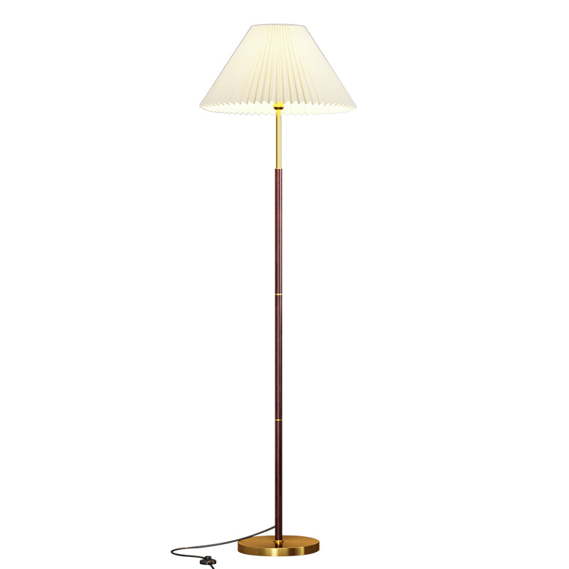Floor lamp with pleated shade on a white background