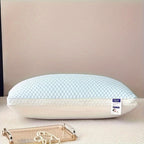 White pillow with a brand label on a beige surface