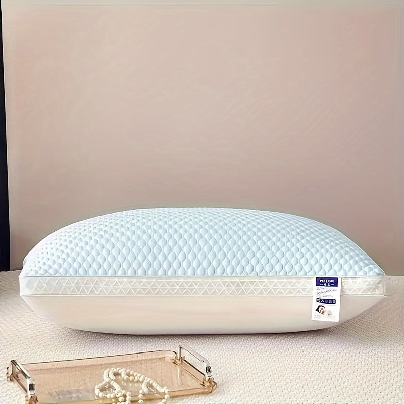White pillow with a brand label on a beige surface