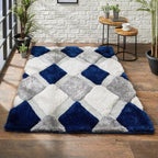 Checkered area rug with blue, gray, and white squares on a wooden floor.