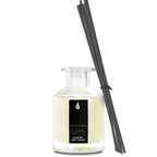 Reed diffuser with black sticks and 'SPA' label on a white background