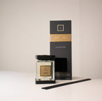 Home fragrance diffuser with packaging on a light background