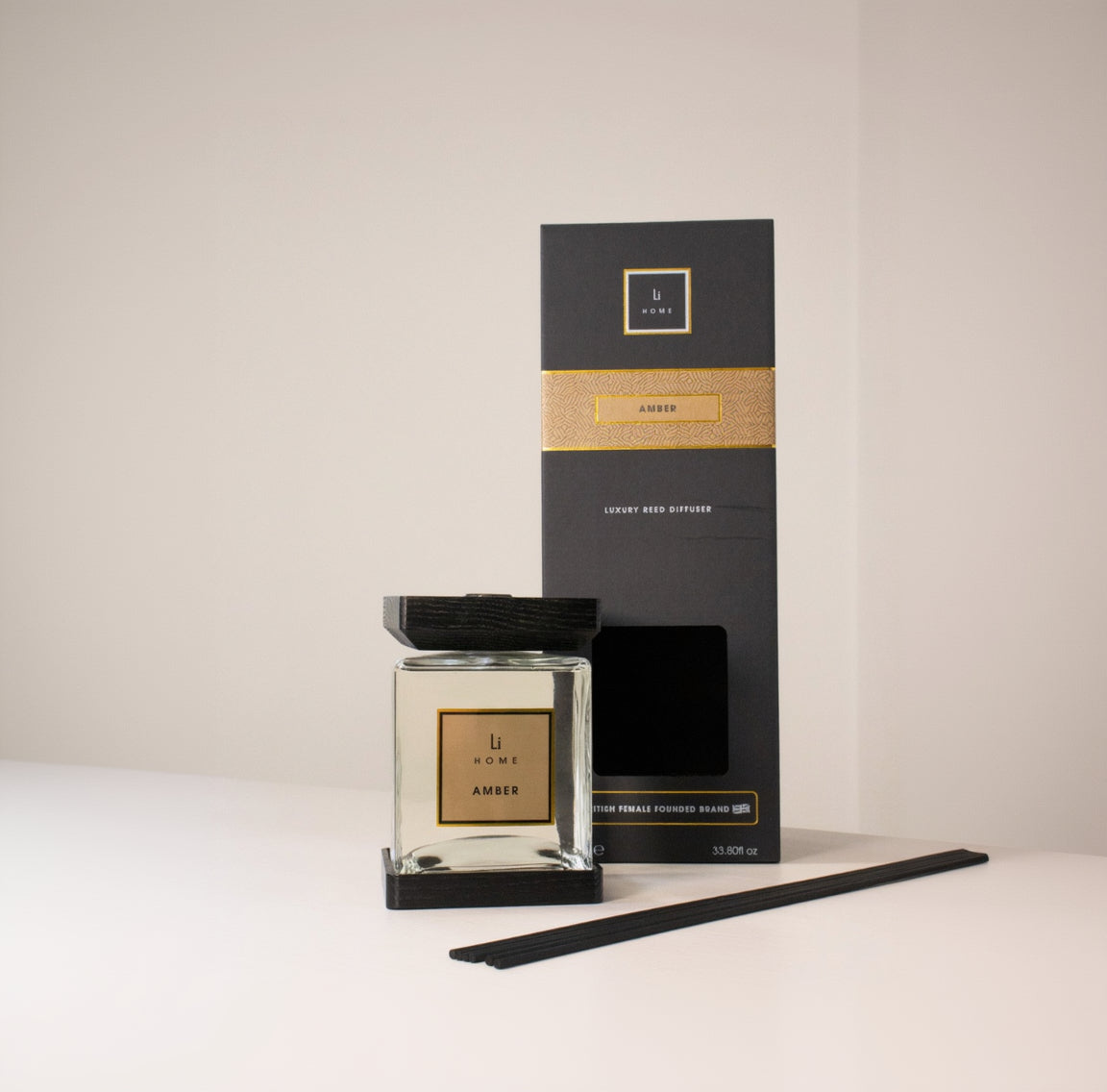 Home fragrance diffuser with packaging on a light background