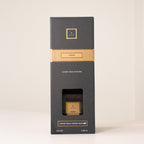 Black and gold box with a window on a white background