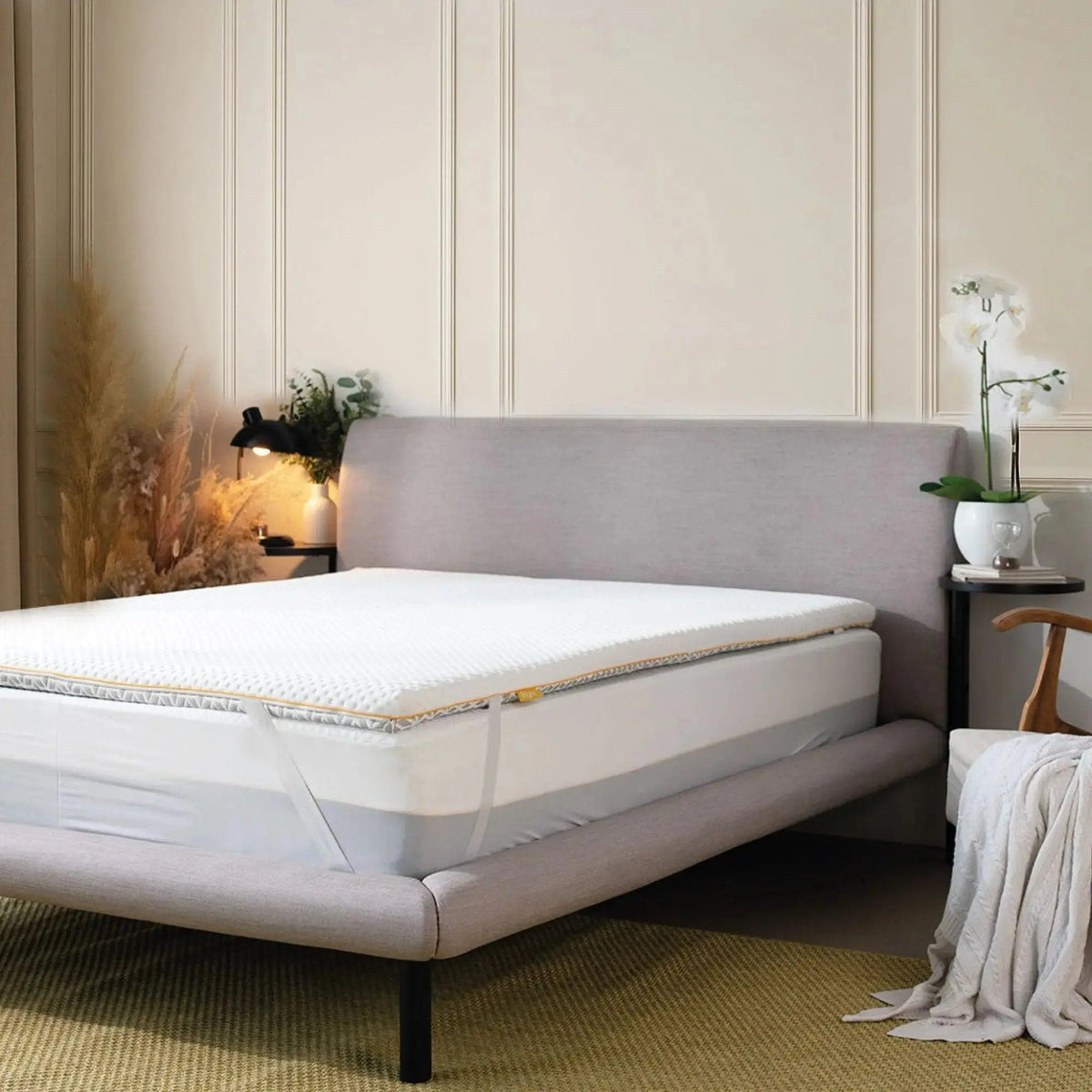 Mattress topper on a bed in a bedroom setting