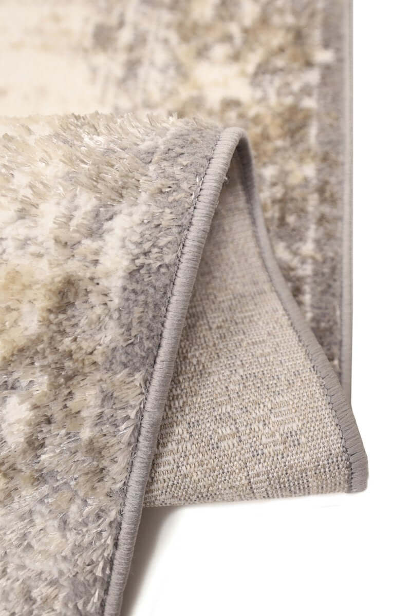 Close-up of a textured beige rug corner