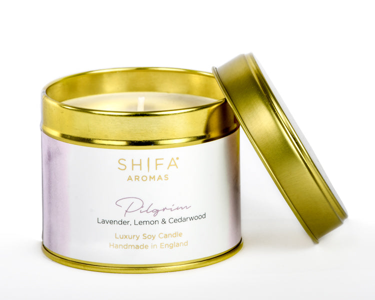Shifa Aromas candle in a gold lid container on a white background