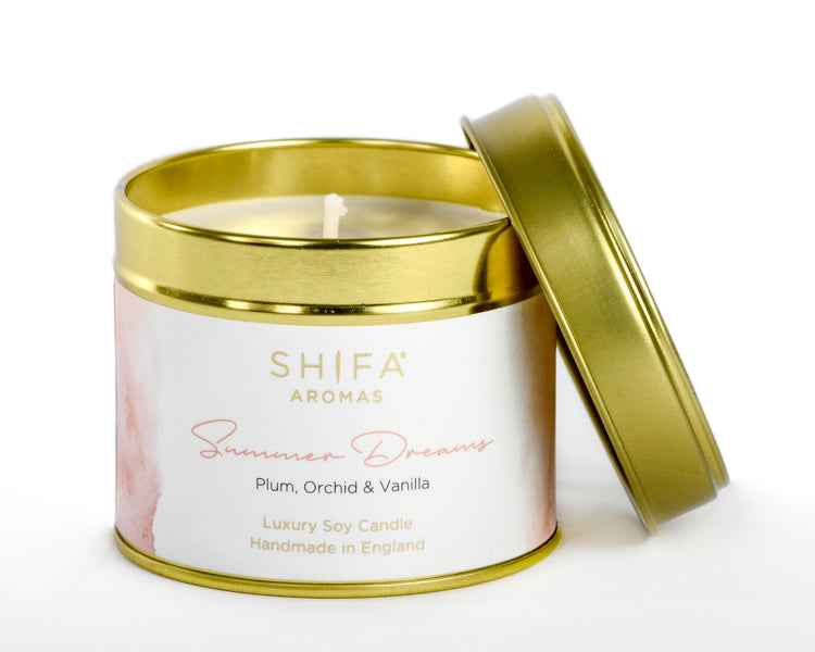 Shifa Aromas candle in a gold tin with a white label on a white background