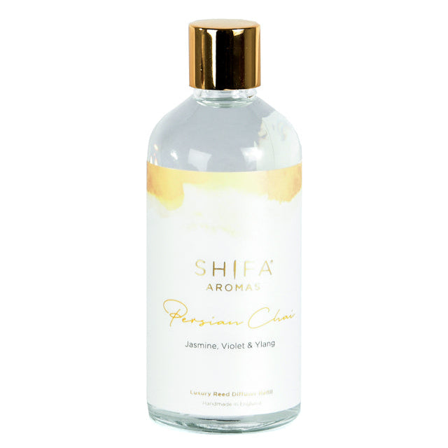 Shifa Aroma bottle with gold cap and label on a white background