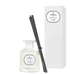 Parks diffuser bottle with black sticks and packaging on a white background