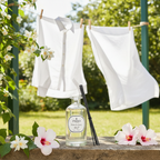 PARKS laundry detergent bottle with white clothes on a clothesline in a garden setting