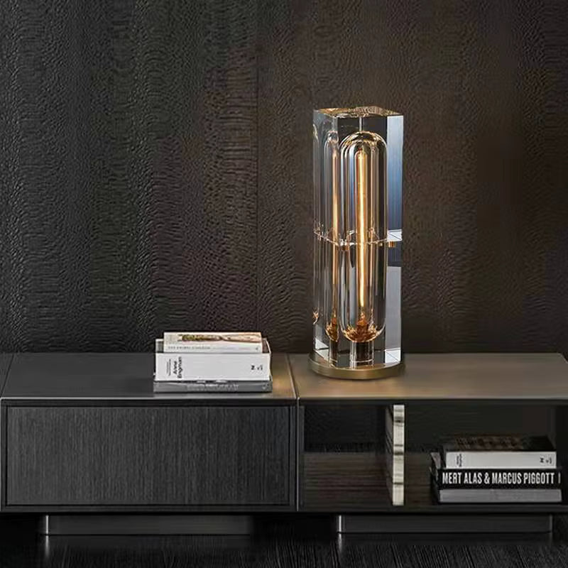 Modern table lamp on a dark wooden surface with a textured black wall background