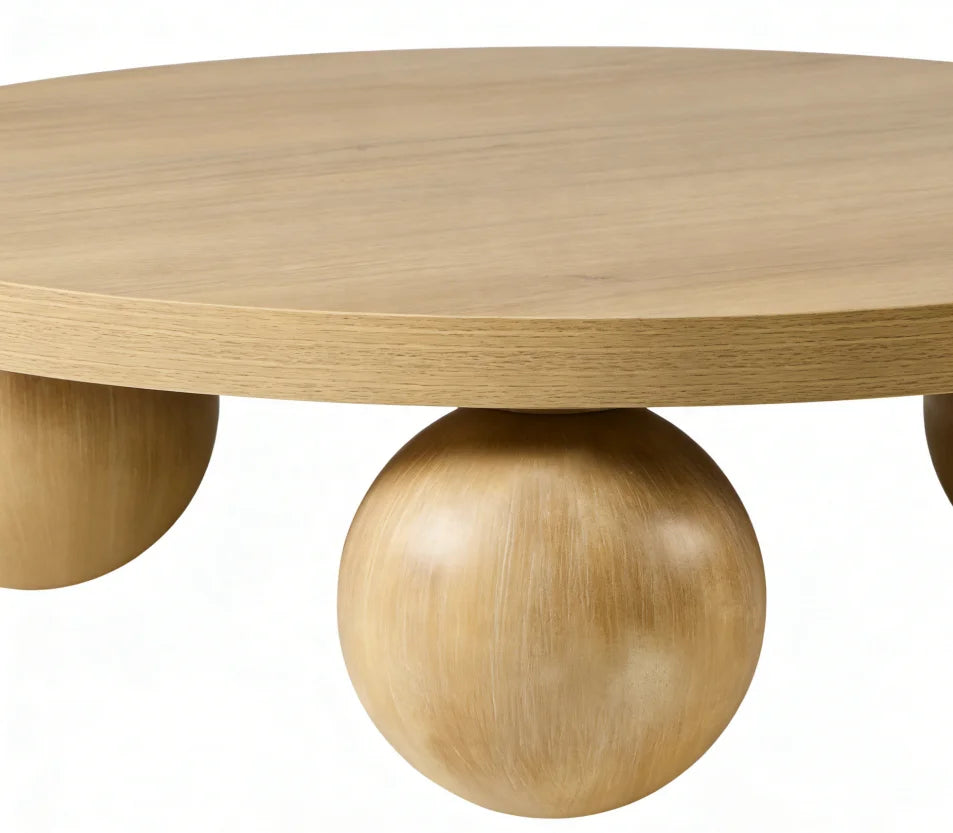 Wooden coffee table with spherical legs on a white background