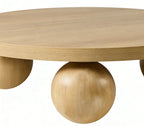 Wooden coffee table with spherical legs on a white background