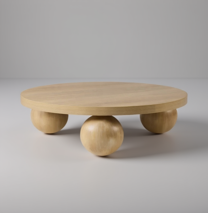 Wooden coffee table with spherical bases on a plain background