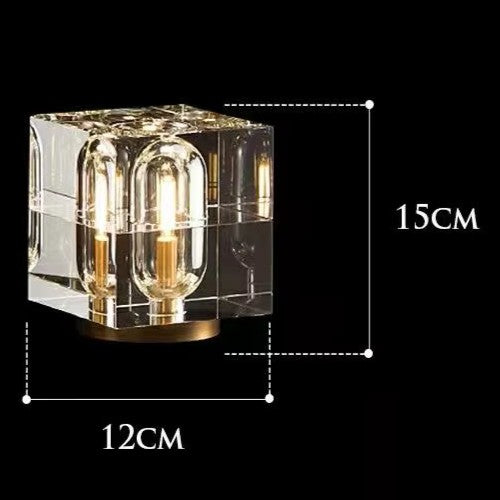 Clear cube-shaped lamp with dimensions labeled on a black background