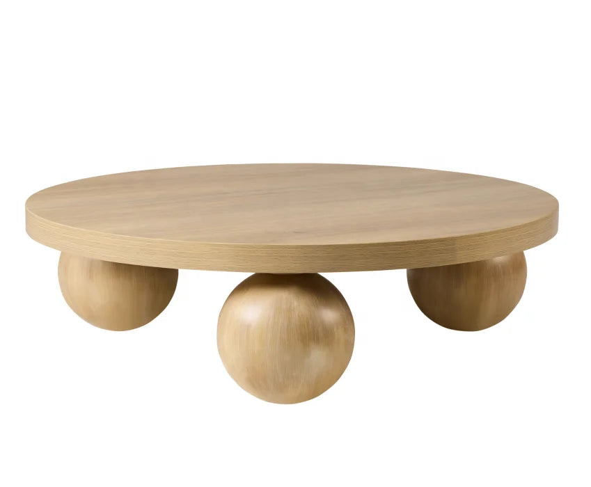 Wooden coffee table with spherical legs on a white background