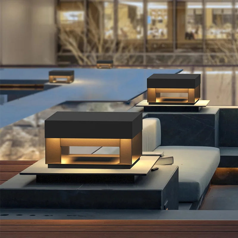 Modern outdoor furniture with built-in lighting by a poolside.