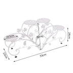 White metal plant stand with floral design and dimensions labeled on a white background