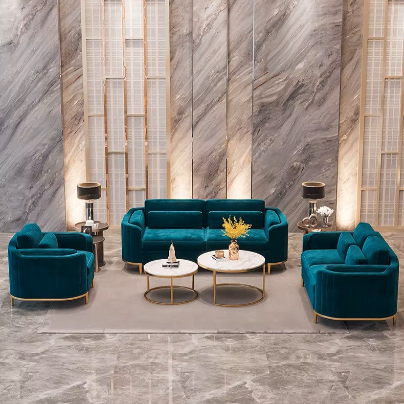 Modern living room with teal sofas and marble walls