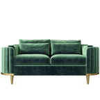 Green velvet sofa with gold legs on a white background