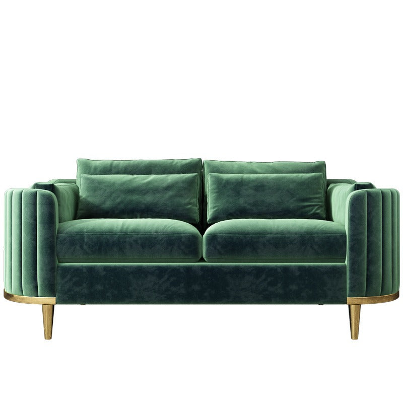 Green velvet sofa with gold legs on a white background