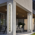 Modern outdoor setting with decorative wall lights on a building exterior.