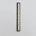 Vertical wall light fixture with geometric design on a gray background