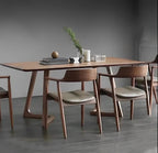 Dining table with chairs in a modern room setting