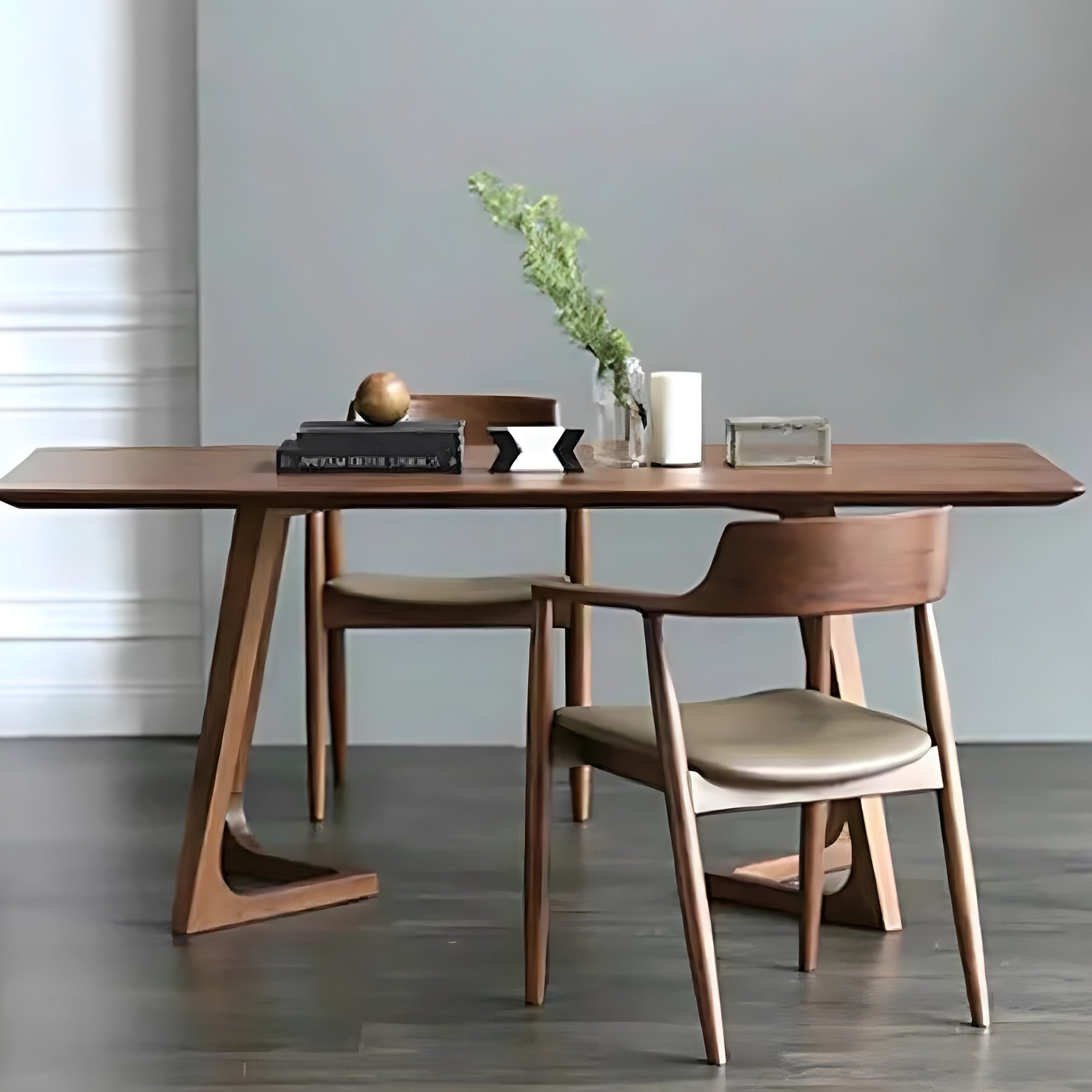 Wooden dining table with chairs in a minimalistic room.