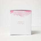 White box with pink watercolor design and text on a white background