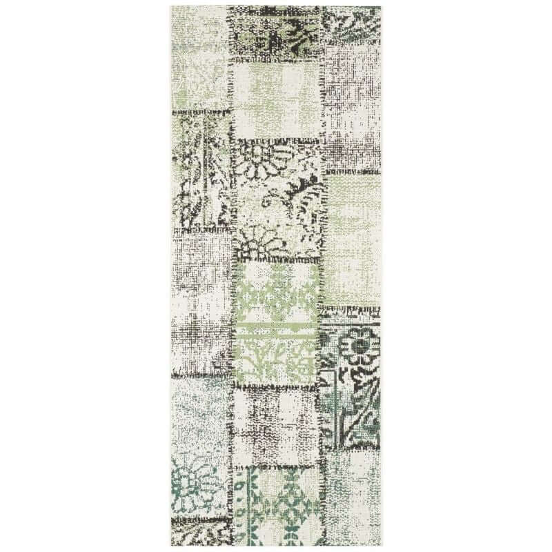 Patterned rug with green and beige tones on a white background