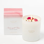 Shifa Aromas candle with rose petals and packaging on a white background