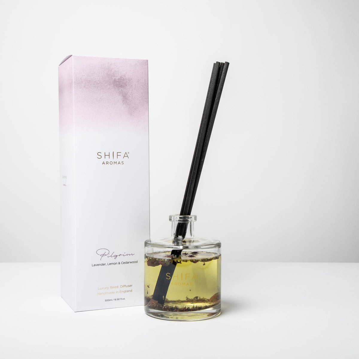 Shifa Aromas diffuser bottle with black reed and packaging on a white background