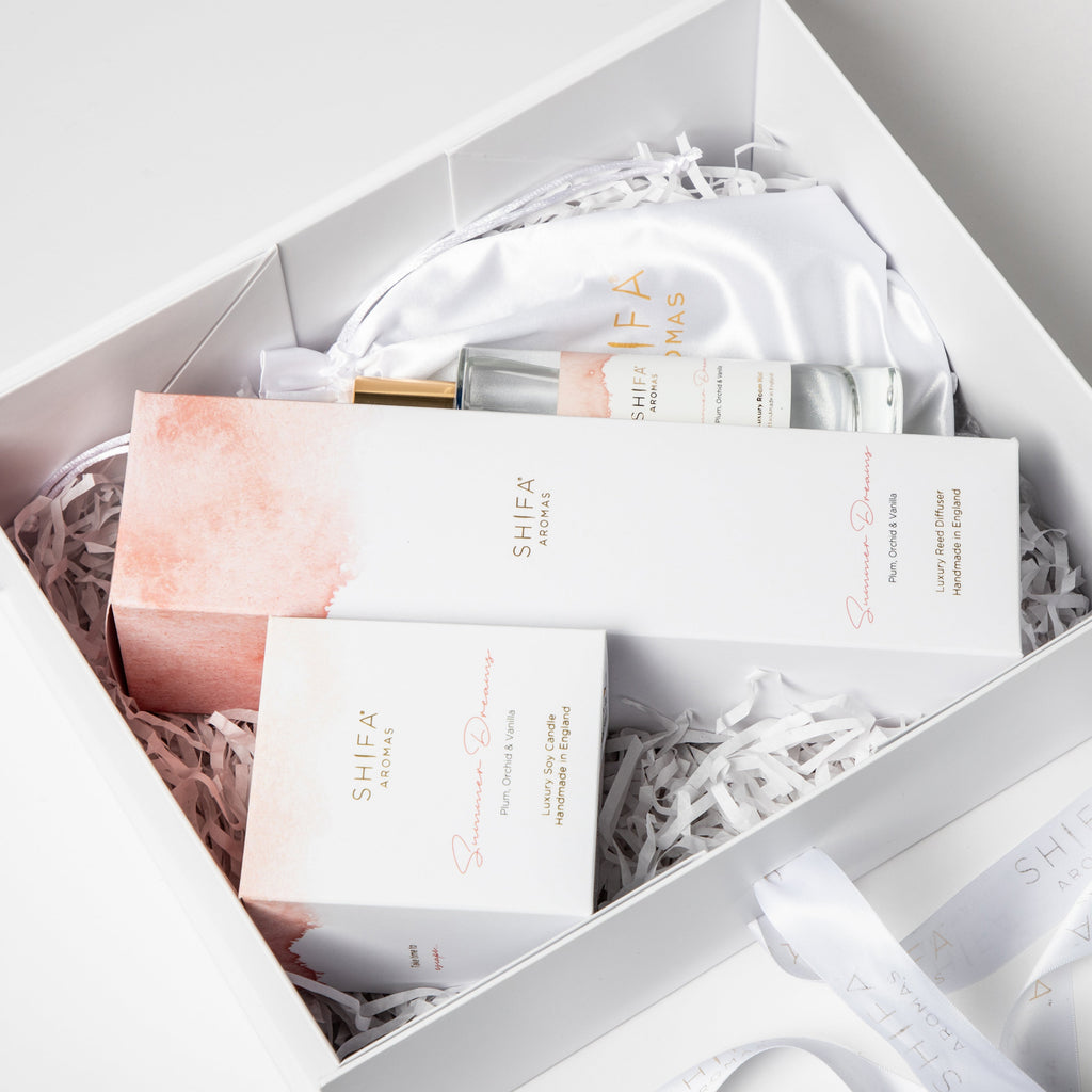 Shea Moisture skincare products in a white box with shredded paper