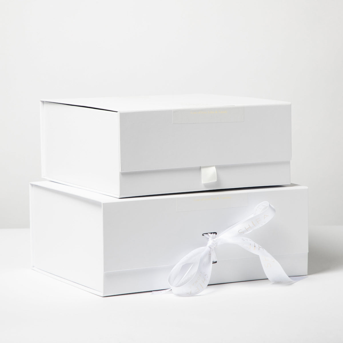 White shoe box with a white sock on a white background