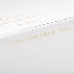 White card with gold text 'Lots of love John & Family' on a white background