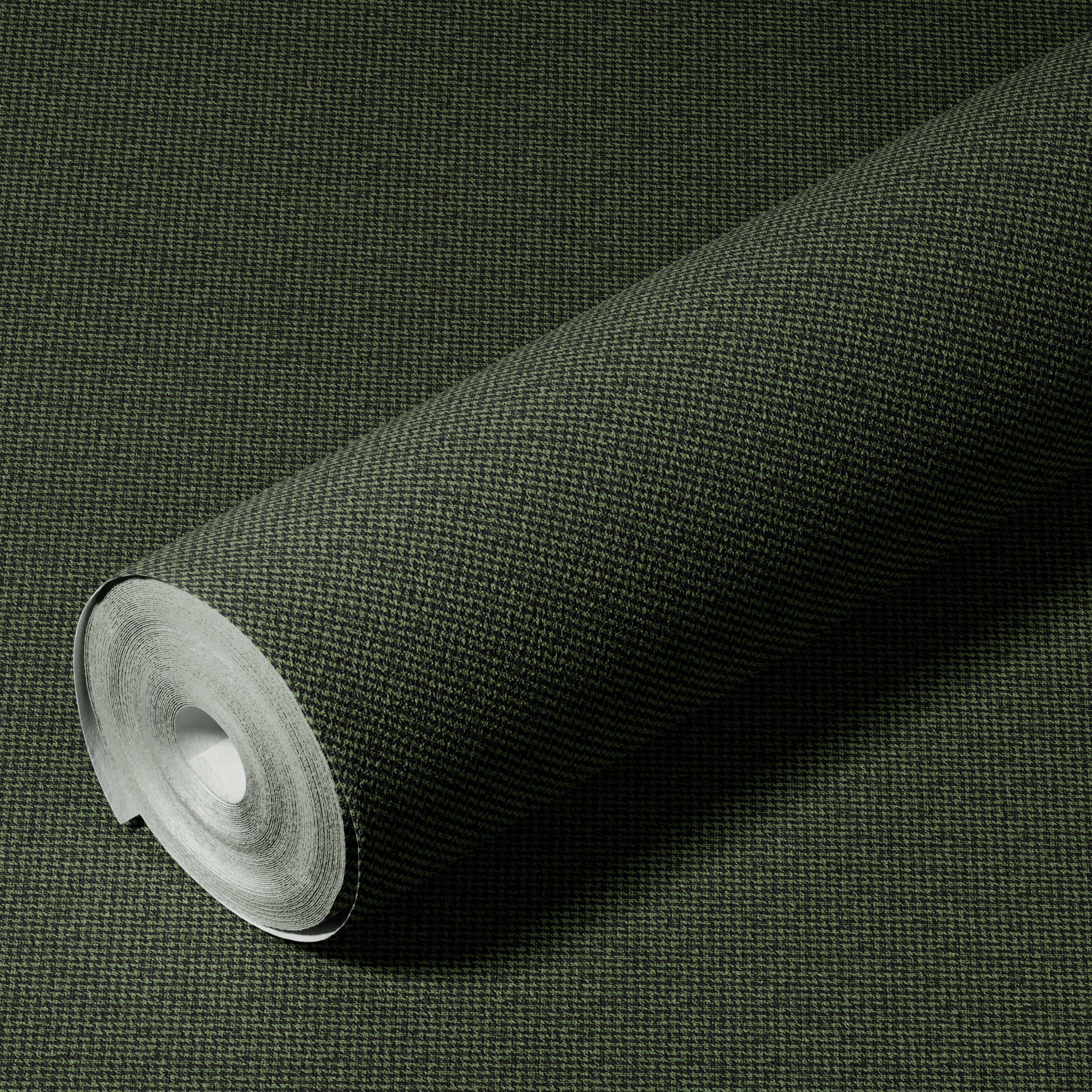 Roll of green textured wallpaper on a matching background