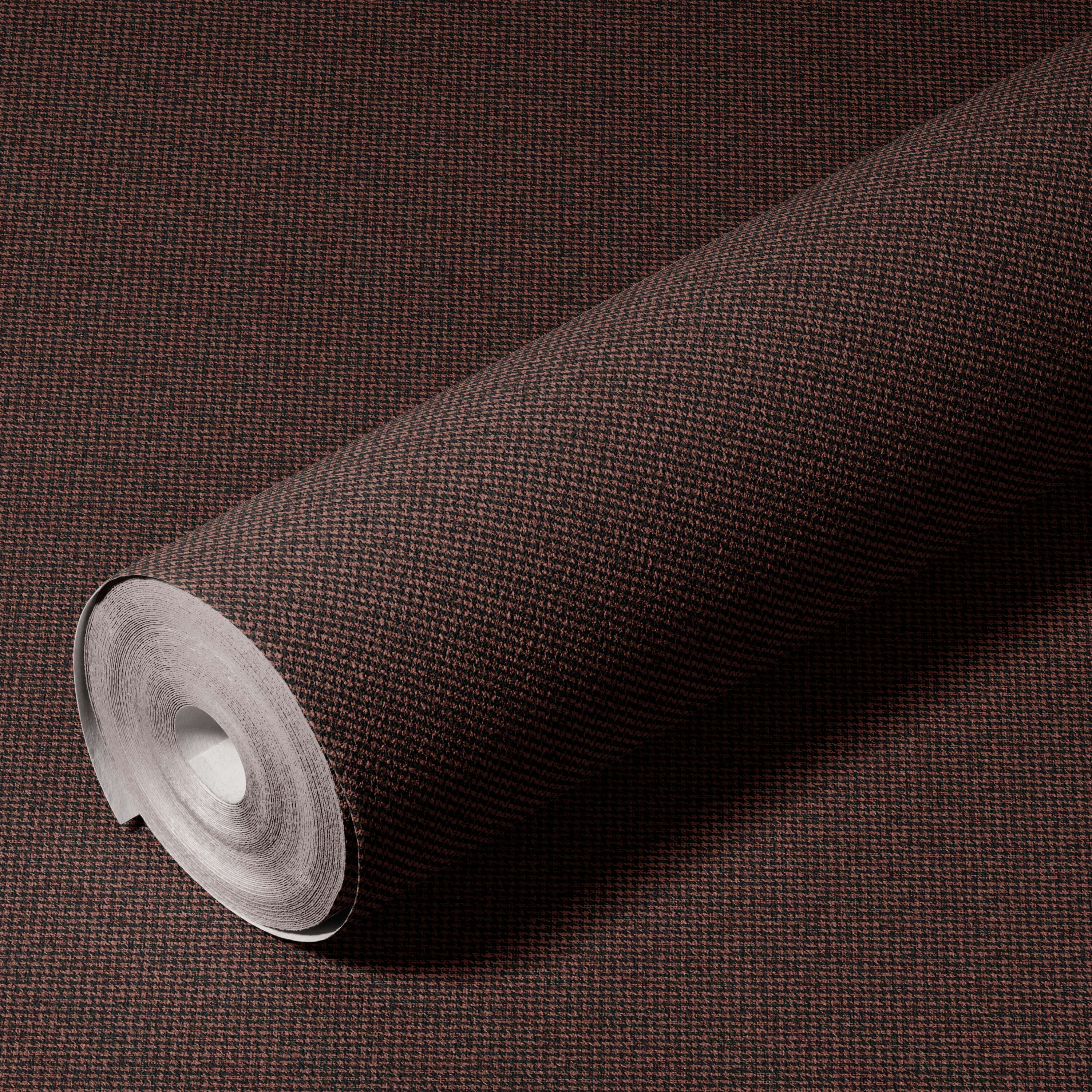 Roll of brown textured wallpaper on a matching brown background