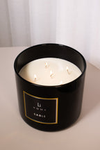 Black candle jar with 'Li Home Sable' label on a white background