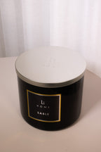 Black candle jar with 'LH Home' label on a white background